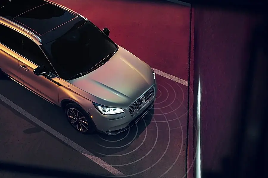 Aerial view of Lincoln SUV parking with active proximity sensor alerts